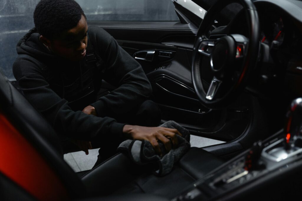 Person cleaning car interior
